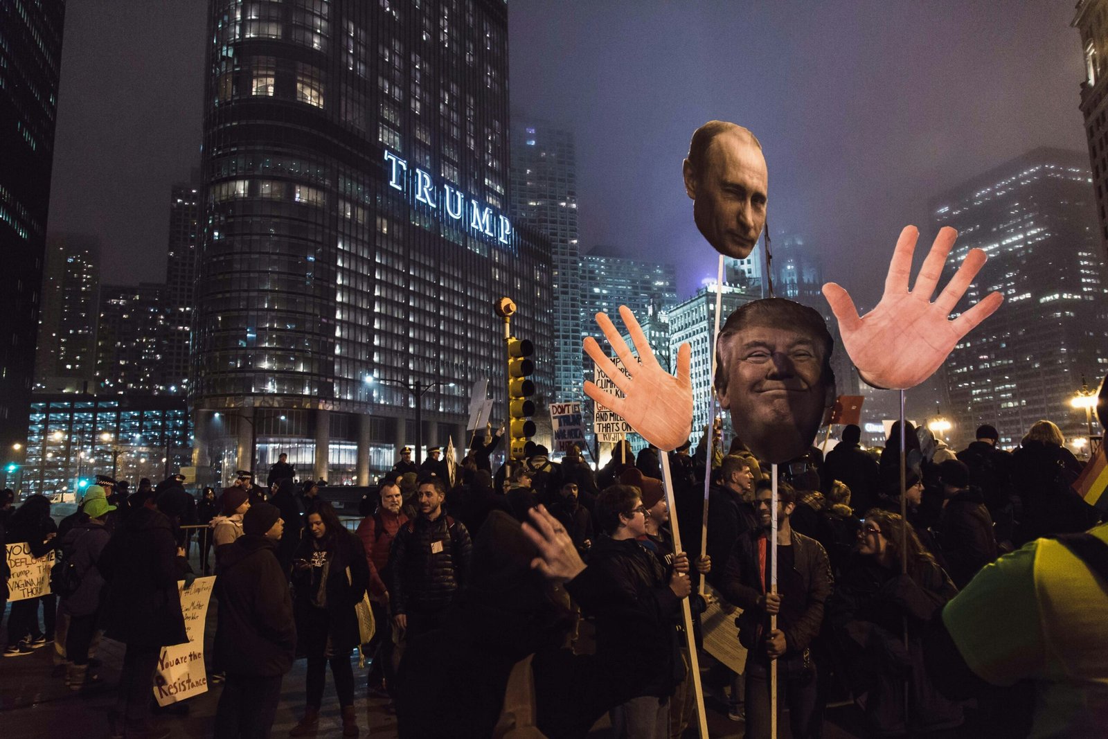 people gathers in the street near Trump building